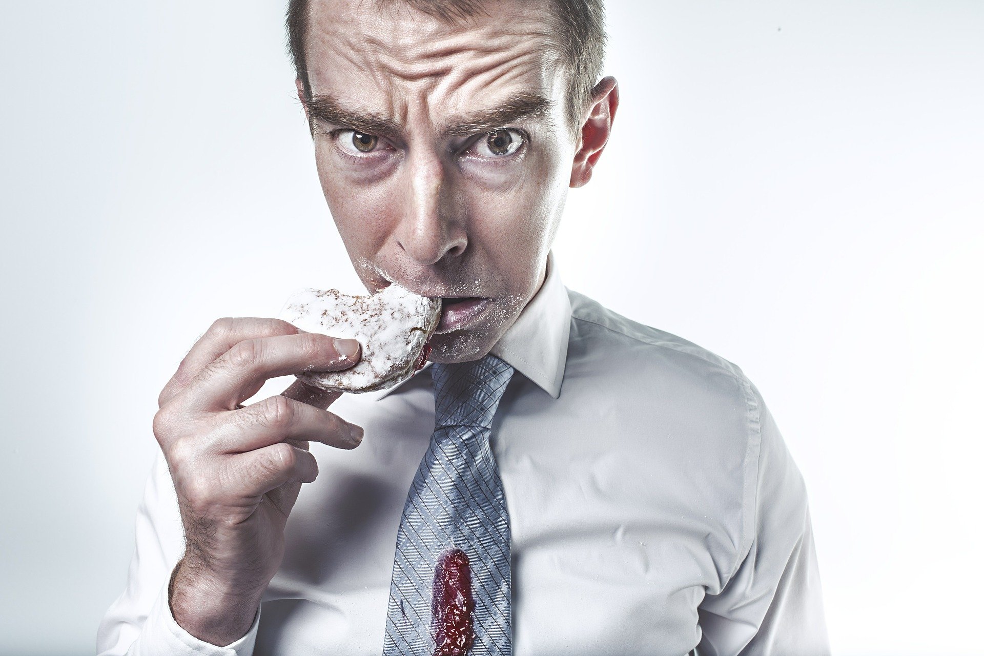 man eating cookie